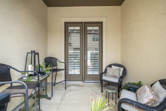 doorway to property with a patio area and french doors