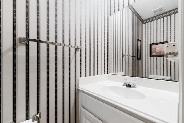 bathroom featuring vanity and a textured ceiling