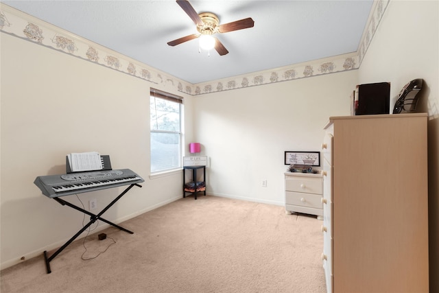 miscellaneous room with ceiling fan and light carpet