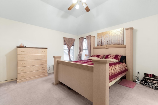 carpeted bedroom featuring vaulted ceiling and ceiling fan