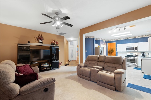 living room with ceiling fan and light colored carpet