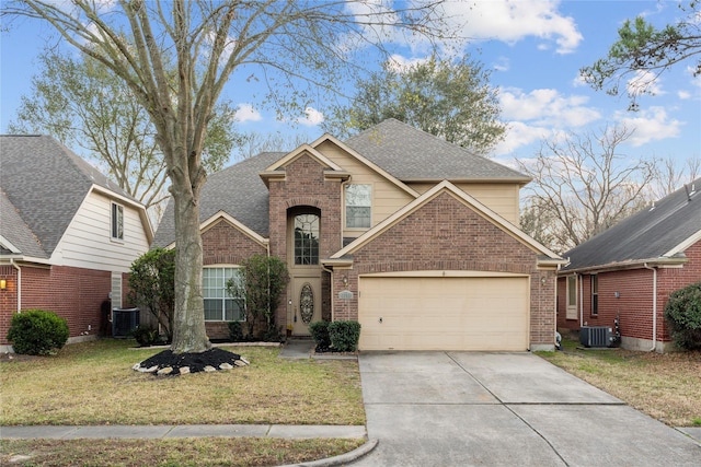 front of property with cooling unit, a garage, and a front lawn