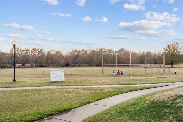 view of home's community with a yard