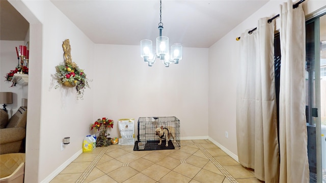 dining area featuring light tile patterned flooring and a notable chandelier