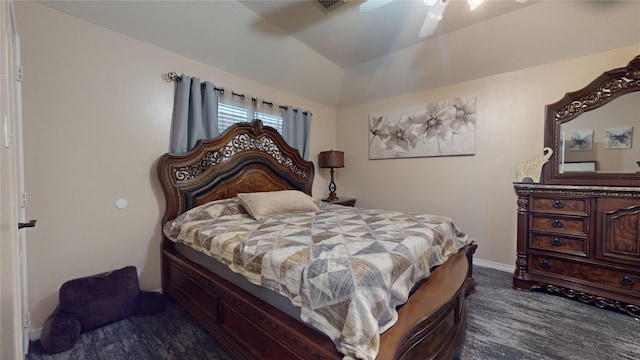 carpeted bedroom with vaulted ceiling and ceiling fan