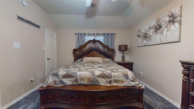 carpeted bedroom with vaulted ceiling and ceiling fan