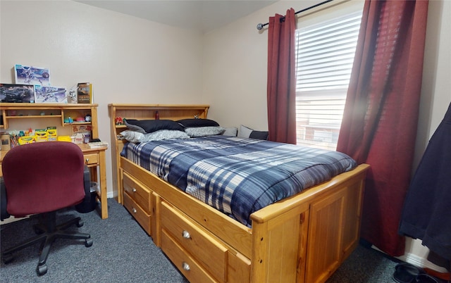 bedroom with multiple windows and carpet