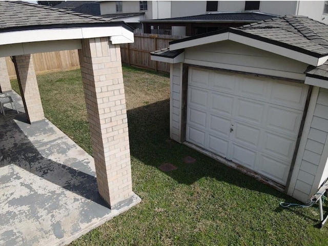 garage featuring a yard