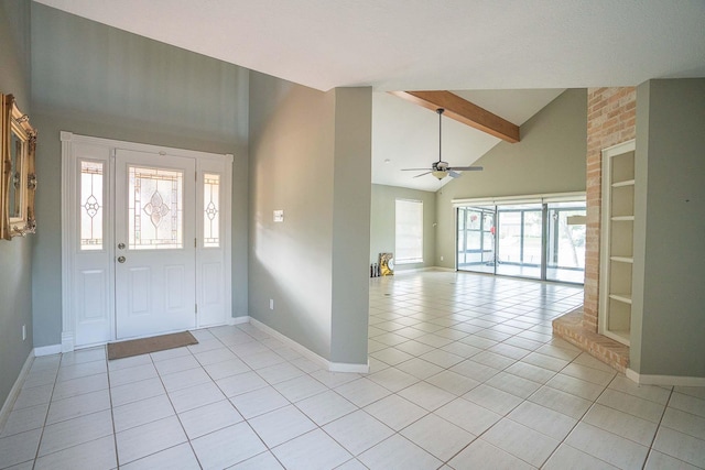 foyer entrance featuring light tile patterned flooring, ceiling fan, high vaulted ceiling, and beamed ceiling