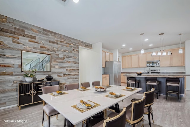 3215 Laurel Bend Ln, Pearland, TX 77584 - dining room with light wood-style flooring, recessed lighting, and wood walls
