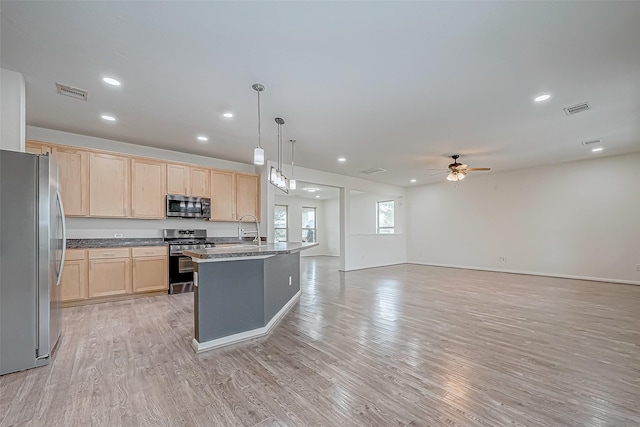 3215 Laurel Bend Ln, Pearland, TX 77584 - kitchen featuring appliances with stainless steel finishes, light brown cabinets, a ceiling fan, light wood-style flooring, and recessed lighting