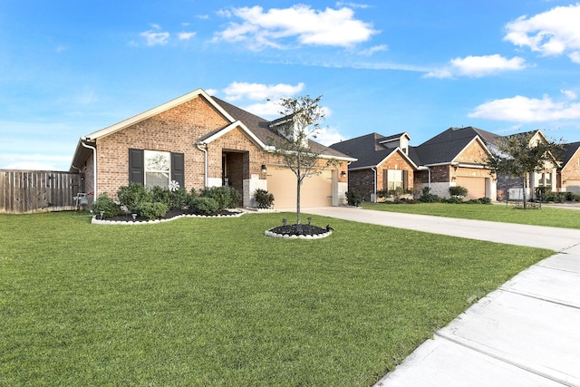 view of front facade featuring fence, driveway, an attached garage, a front lawn, and brick siding