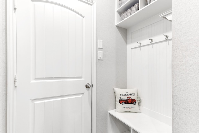 mudroom with a textured wall