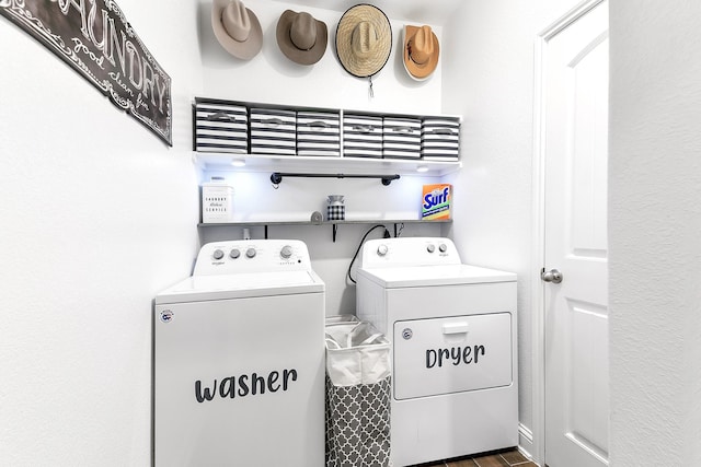 washroom featuring washing machine and dryer and laundry area