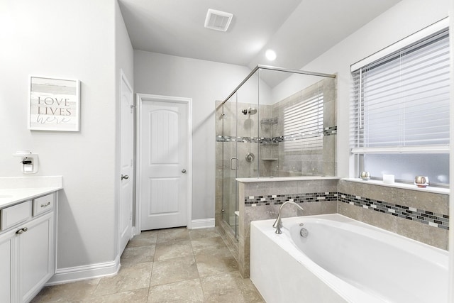 full bathroom featuring visible vents, baseboards, a stall shower, a bath, and vanity