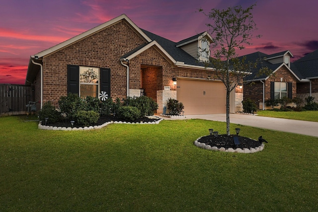 view of front of house featuring brick siding, fence, concrete driveway, a lawn, and a garage