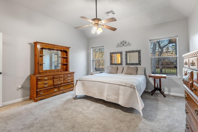 carpeted bedroom featuring ceiling fan and lofted ceiling