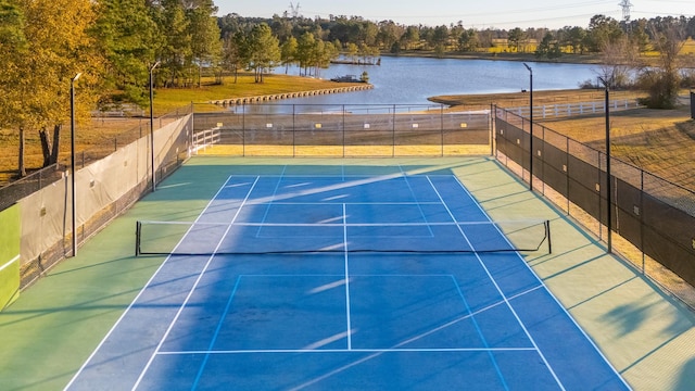 view of sport court featuring a water view