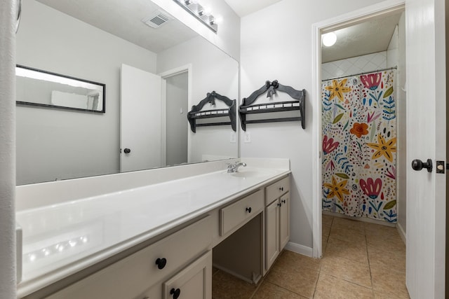 bathroom with vanity, tile patterned flooring, and a shower with curtain