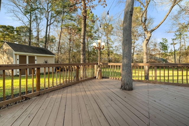 deck featuring a lawn and a storage unit