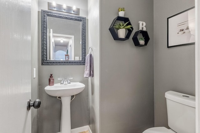 bathroom with sink and toilet