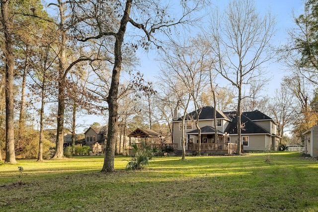 view of yard with a wooden deck