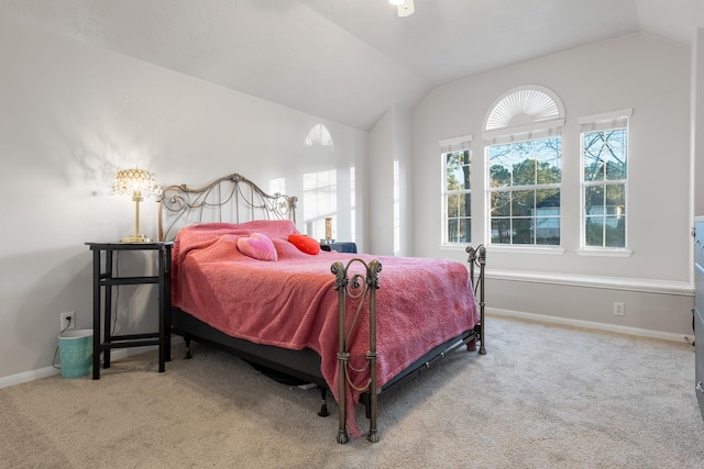 bedroom featuring carpet and vaulted ceiling