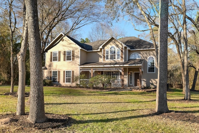 view of front of home with a front yard and a porch