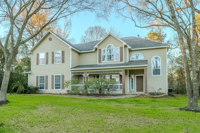 view of front of house featuring central air condition unit, covered porch, and a front lawn