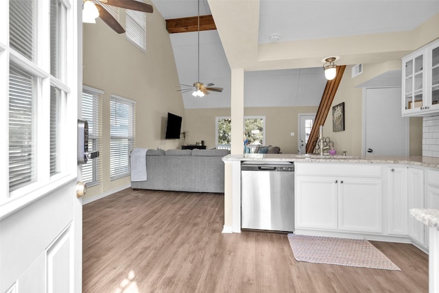 410 Indian Shr, Livingston, TX 77351 - kitchen with dishwasher, a ceiling fan, light wood-type flooring, white cabinetry, and beamed ceiling