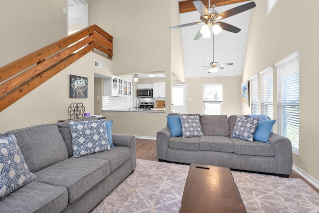 410 Indian Shr, Livingston, TX 77351 - living room featuring a ceiling fan, high vaulted ceiling, and wood finished floors