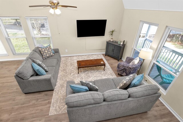 410 Indian Shr, Livingston, TX 77351 - living area featuring wood finished floors, ceiling fan, and vaulted ceiling