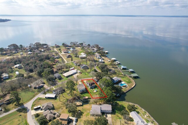 410 Indian Shr, Livingston, TX 77351 - aerial view of residential area featuring property boundaries highlighted and a large body of water