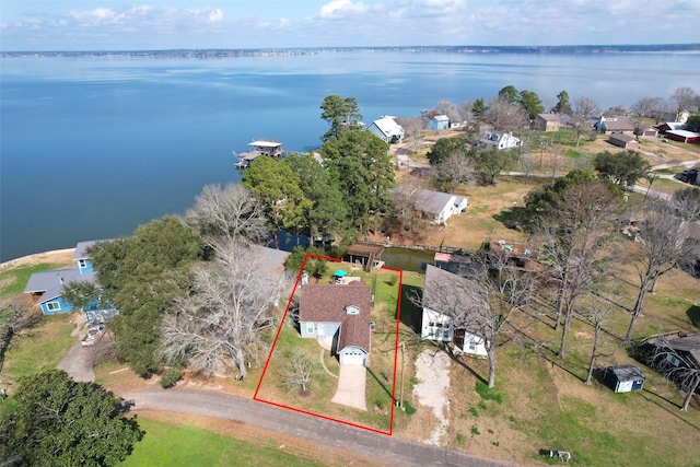 410 Indian Shr, Livingston, TX 77351 - aerial perspective of suburban area with a large body of water and property boundaries highlighted