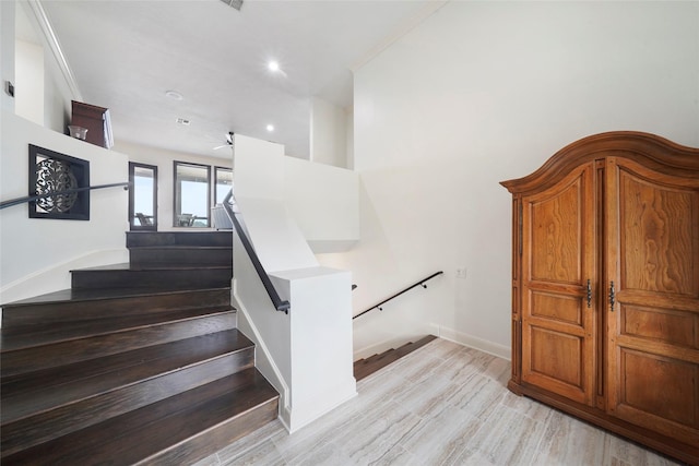 stairs featuring wood-type flooring