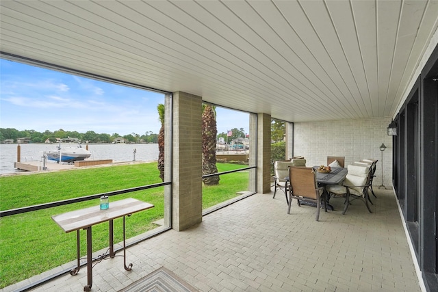 sunroom with a water view