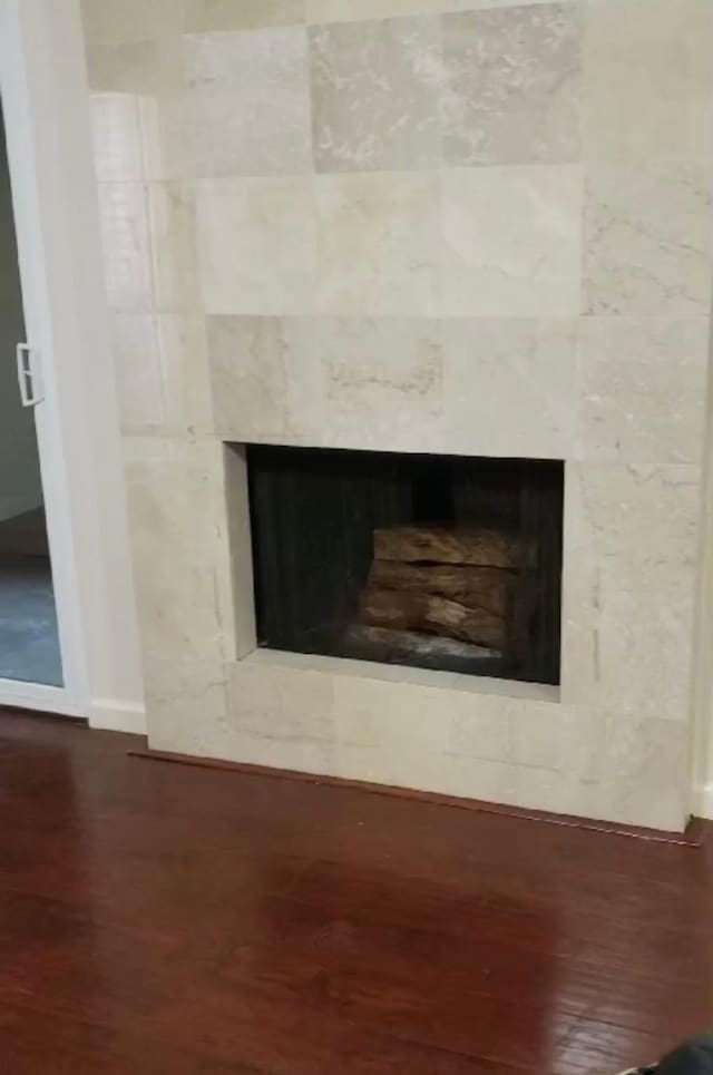 room details featuring hardwood / wood-style flooring and a fireplace