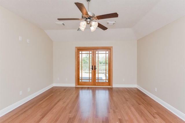 unfurnished room with french doors, ceiling fan, vaulted ceiling, and light wood-type flooring