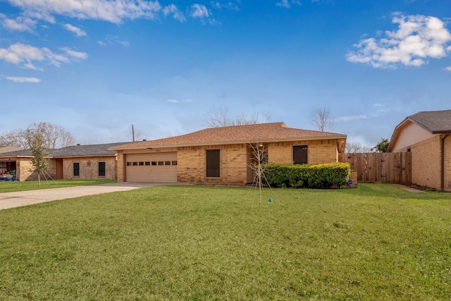 single story home with a garage and a front lawn