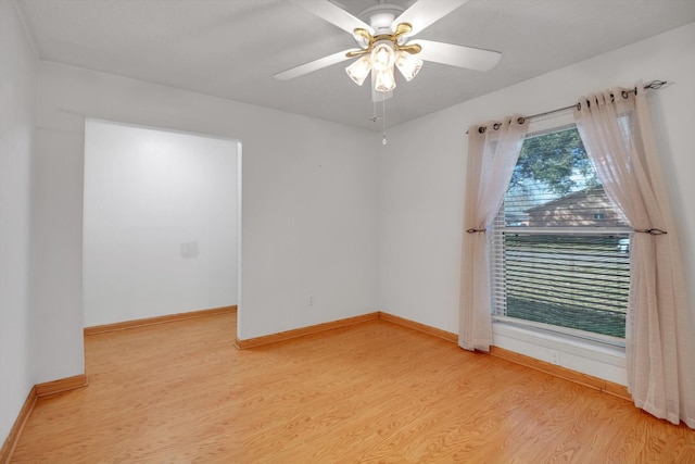 empty room featuring ceiling fan and light wood-type flooring