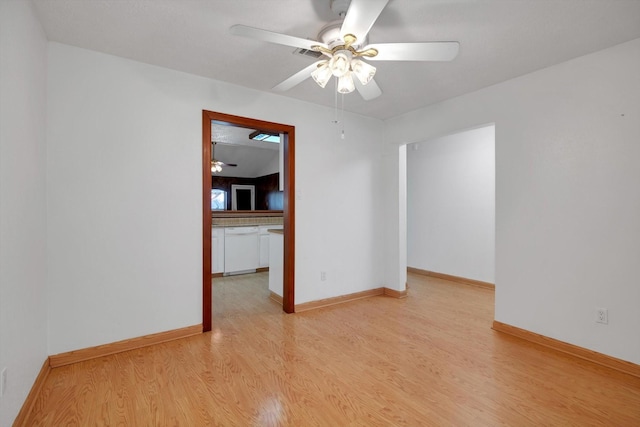 empty room with ceiling fan and light wood-type flooring