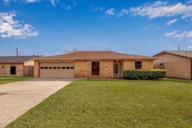 single story home featuring a garage and a front lawn