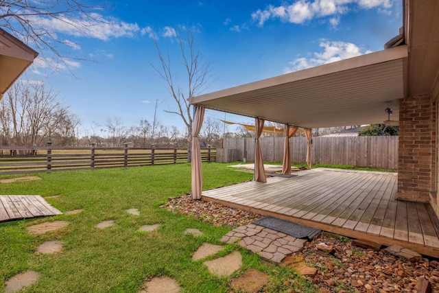 view of yard with a wooden deck