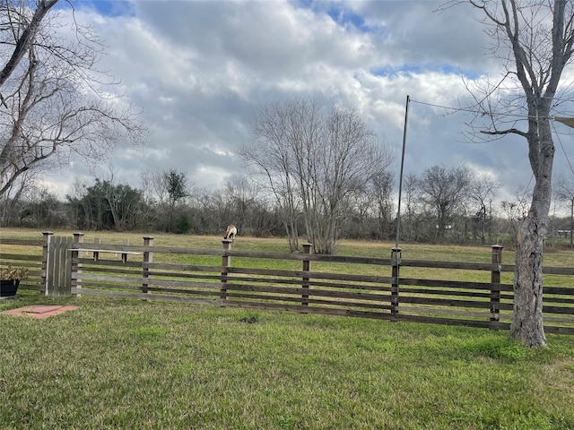 view of yard with a rural view