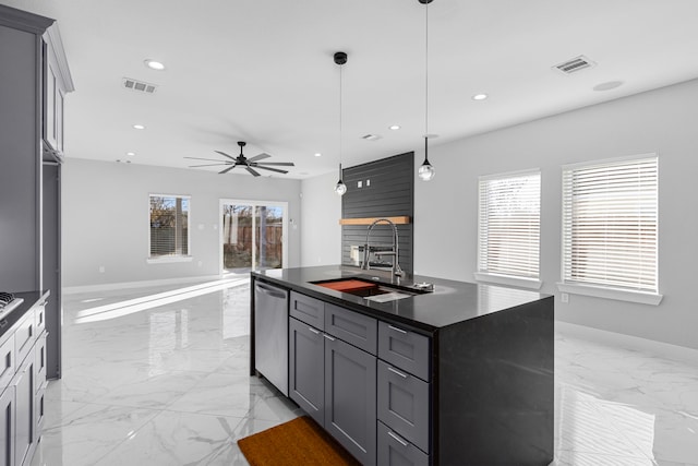 kitchen featuring gray cabinetry, sink, dishwasher, and a center island with sink