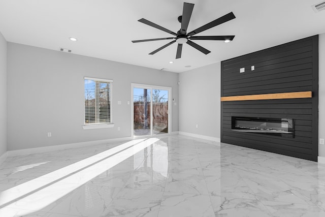 unfurnished living room featuring a fireplace and ceiling fan