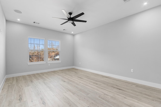 unfurnished room featuring ceiling fan and light wood-type flooring