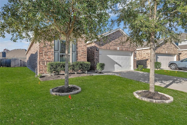 view of front of home with a garage and a front lawn