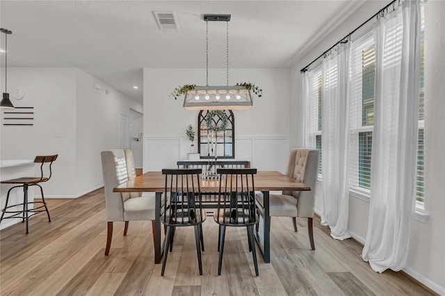 dining area with light hardwood / wood-style floors