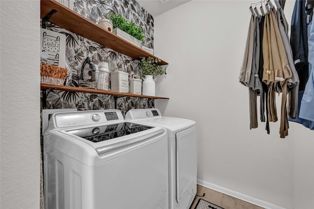 washroom featuring washer and clothes dryer and tile patterned flooring